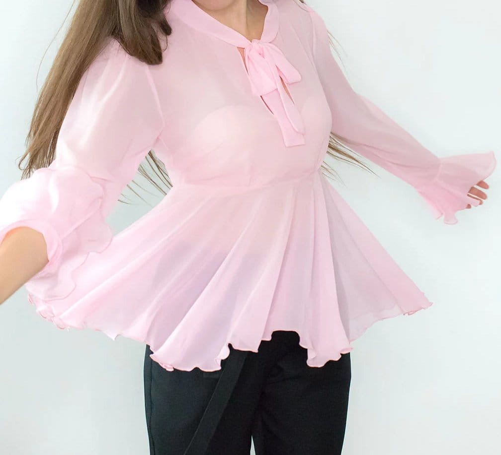 Light pink chiffon top with sheer sleeves and flowing silhouette
