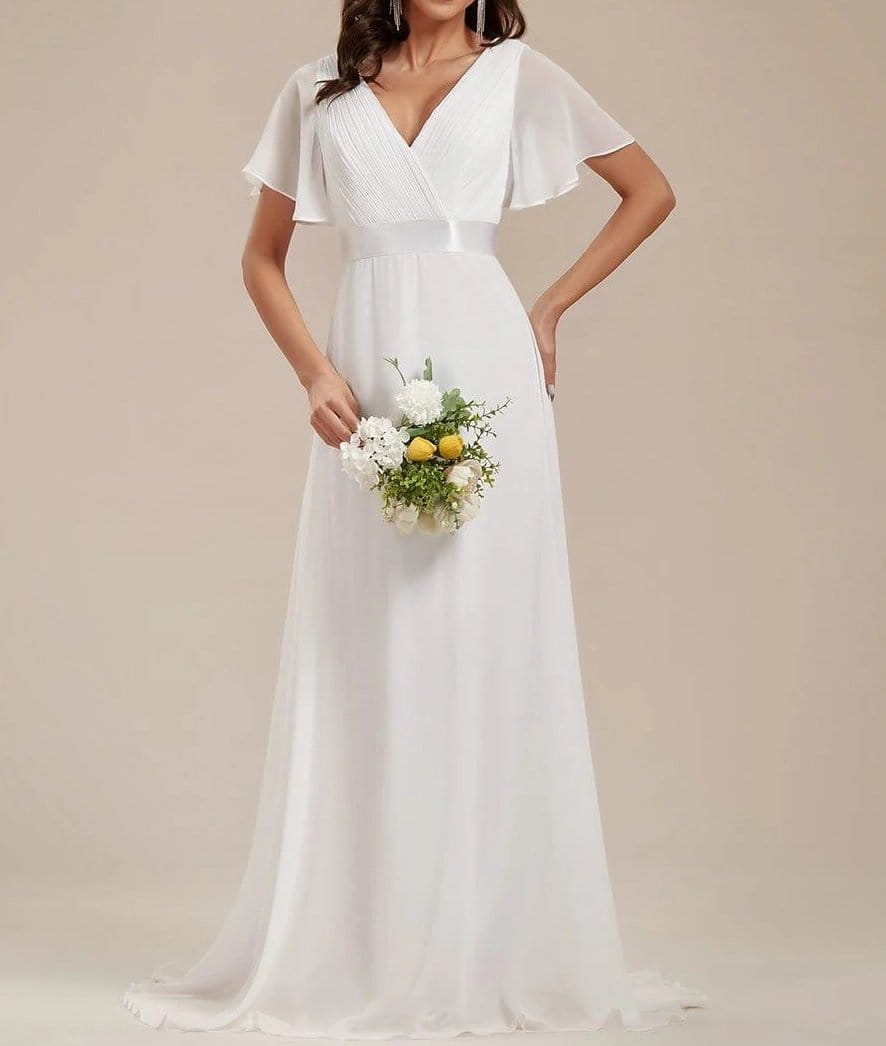 White chiffon wedding dress with flowing skirt and soft draped bodice