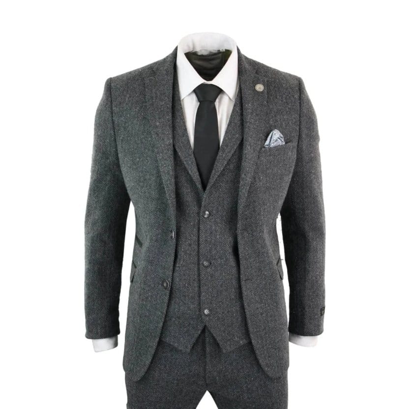 Men's herringbone wool suit in grey showing tailored jacket, waistcoat, and trousers