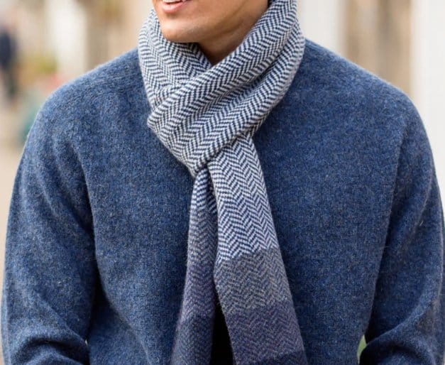 Herringbone wool scarf wrapped around neck for warmth and winter styling
