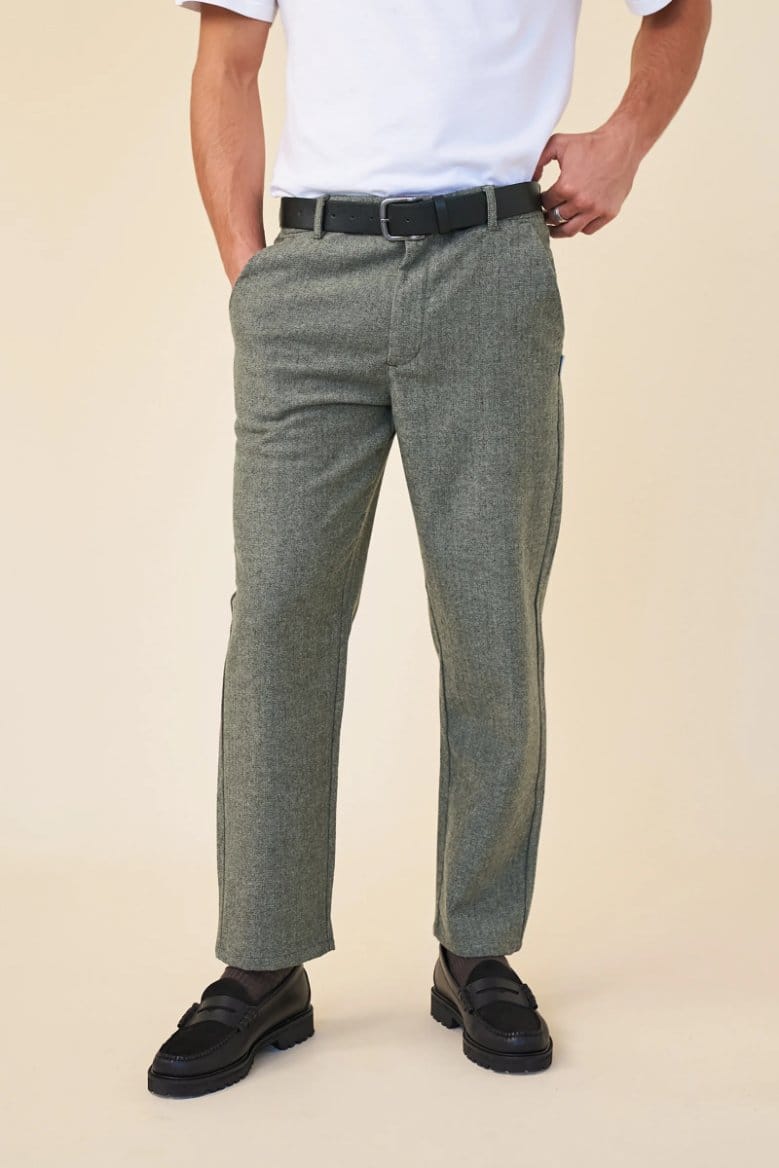 Herringbone wool trousers styled with white shirt and loafers