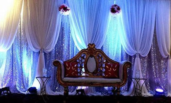 Chiffon drapes used in event decor with layered fabric and soft lighting