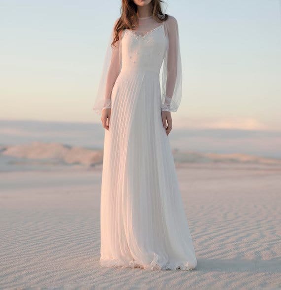 Flowing white bridal dress made from silk chiffon with soft romantic movement