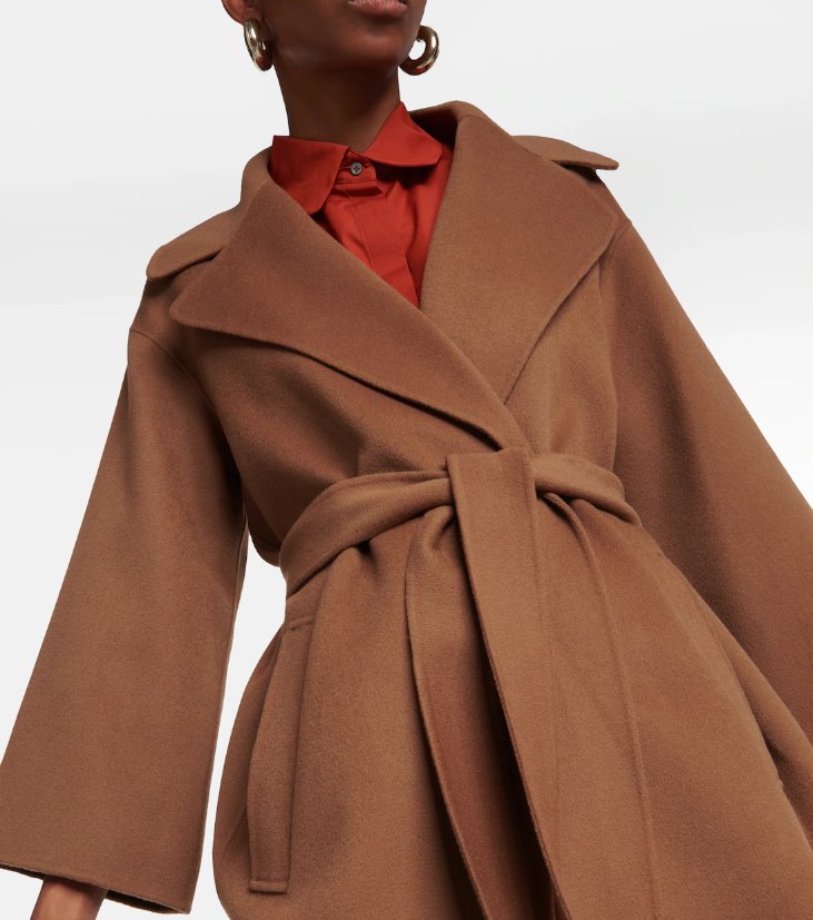 Woman wearing a tailored formal coat made from venetian wool fabric