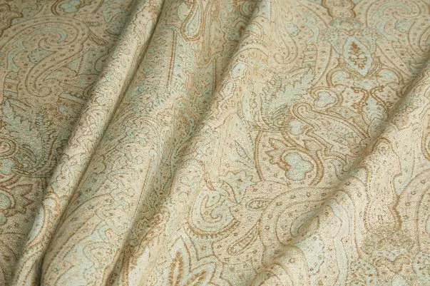 Close up view of wool challis fabric showing fine weave, soft texture, and printed surface