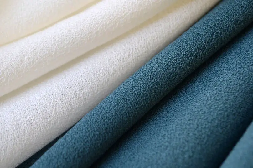 Wool crepe fabric quality indicators showing weave consistency, texture, and fabric finish