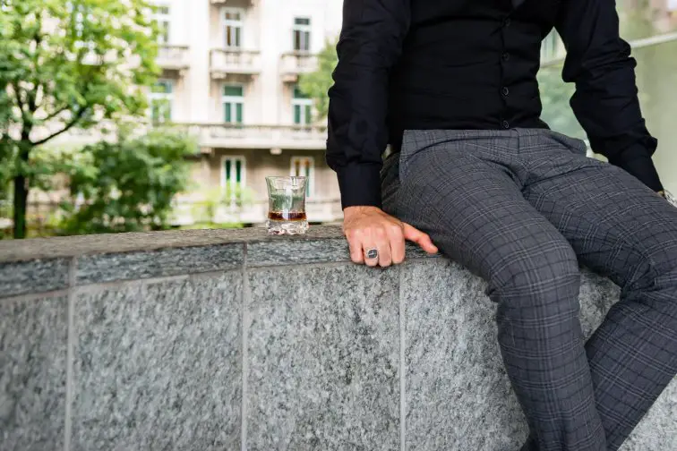 Wool gabardine trousers worn casually showing comfort and tailored structure