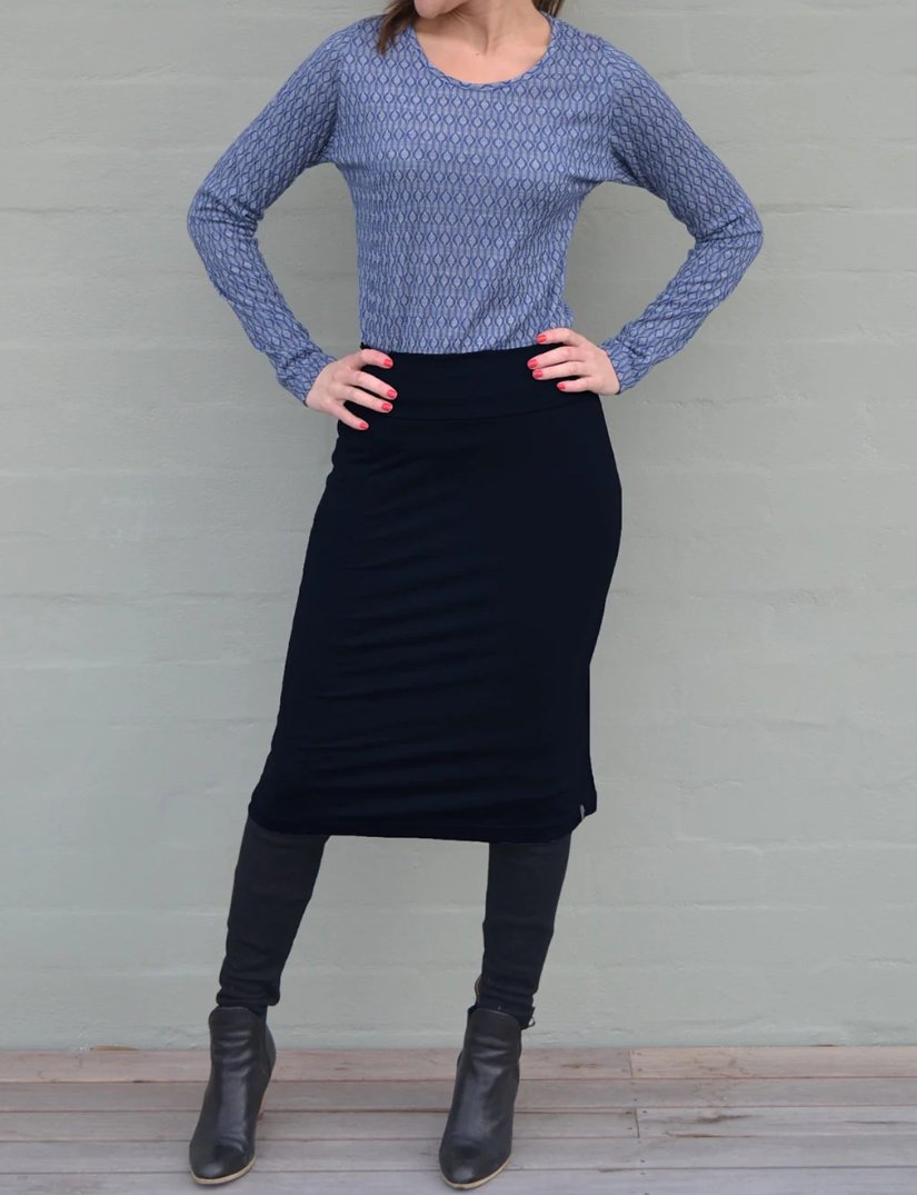 Wool serge A line skirt showing structured drape and smooth tailoring