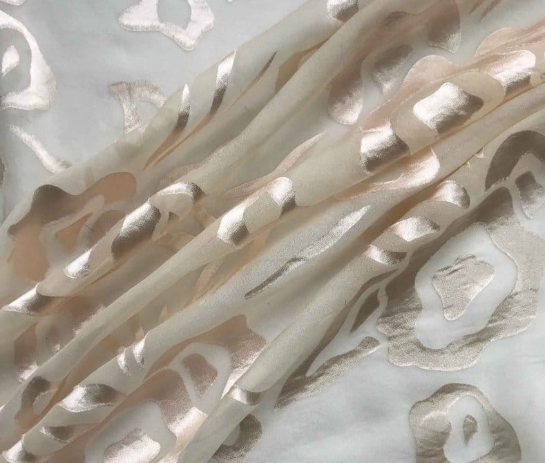 Gold and ivory burnout chiffon demonstrating delicate surface texture