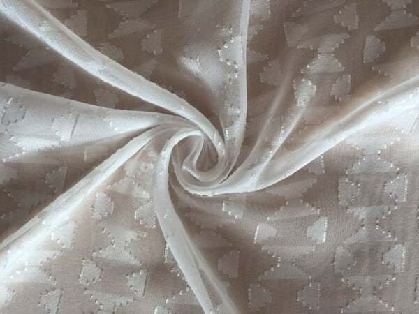 Vintage style burnout fabric with intricate patterns, showcasing traditional textile design and historical techniques