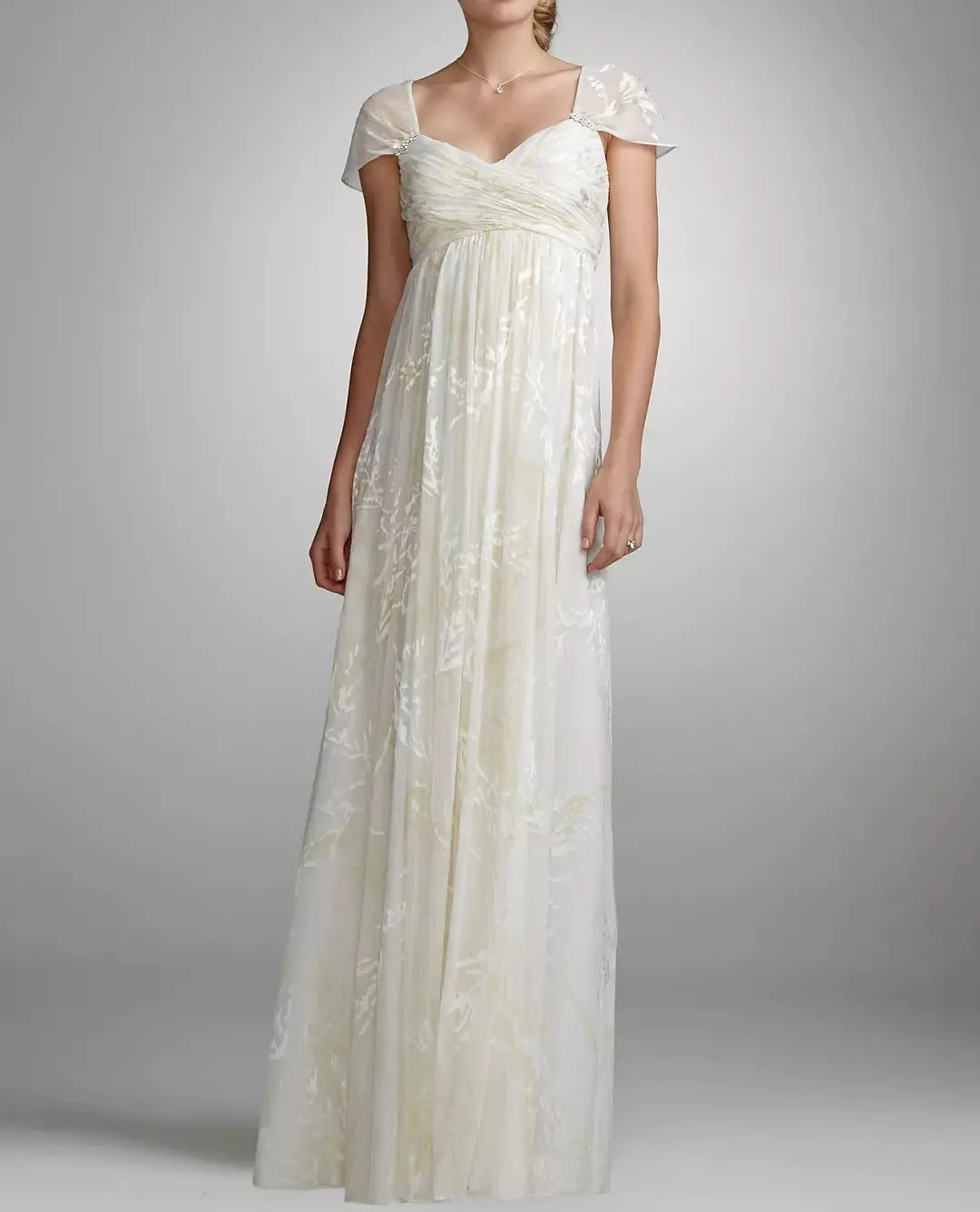 Elegant bridal gown made from burnout chiffon fabric with delicate floral velvet pattern