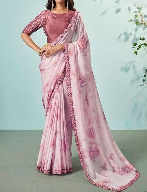 Pink crepe chiffon saree with delicate print and decorative border draped traditionally for lightweight breathable comfort