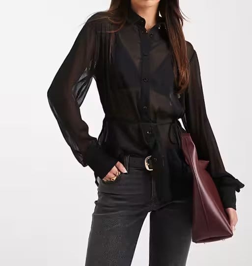 Sheer black crinkle chiffon blouse styled with tailored pants