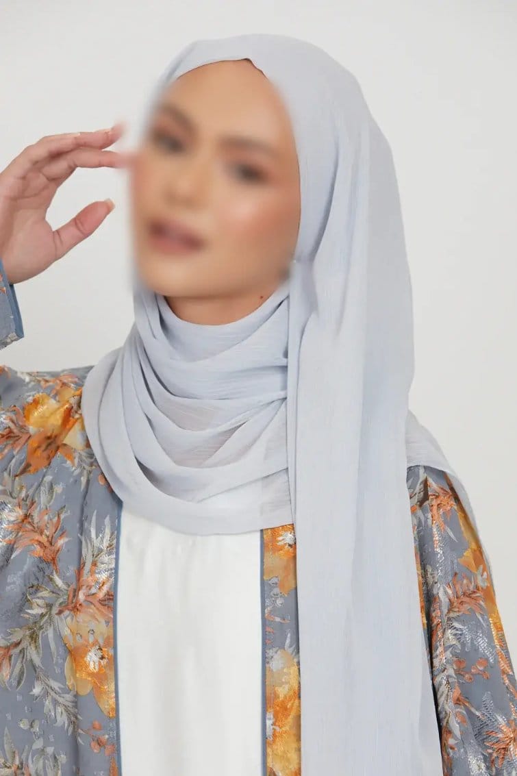 Light gray crinkle chiffon hijab draped smoothly around the head and shoulders