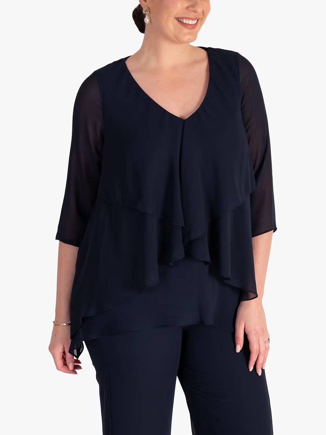 Black double face chiffon blouse with layered asymmetrical hem and sheer sleeves, showing soft texture and elegant drape for formal wear