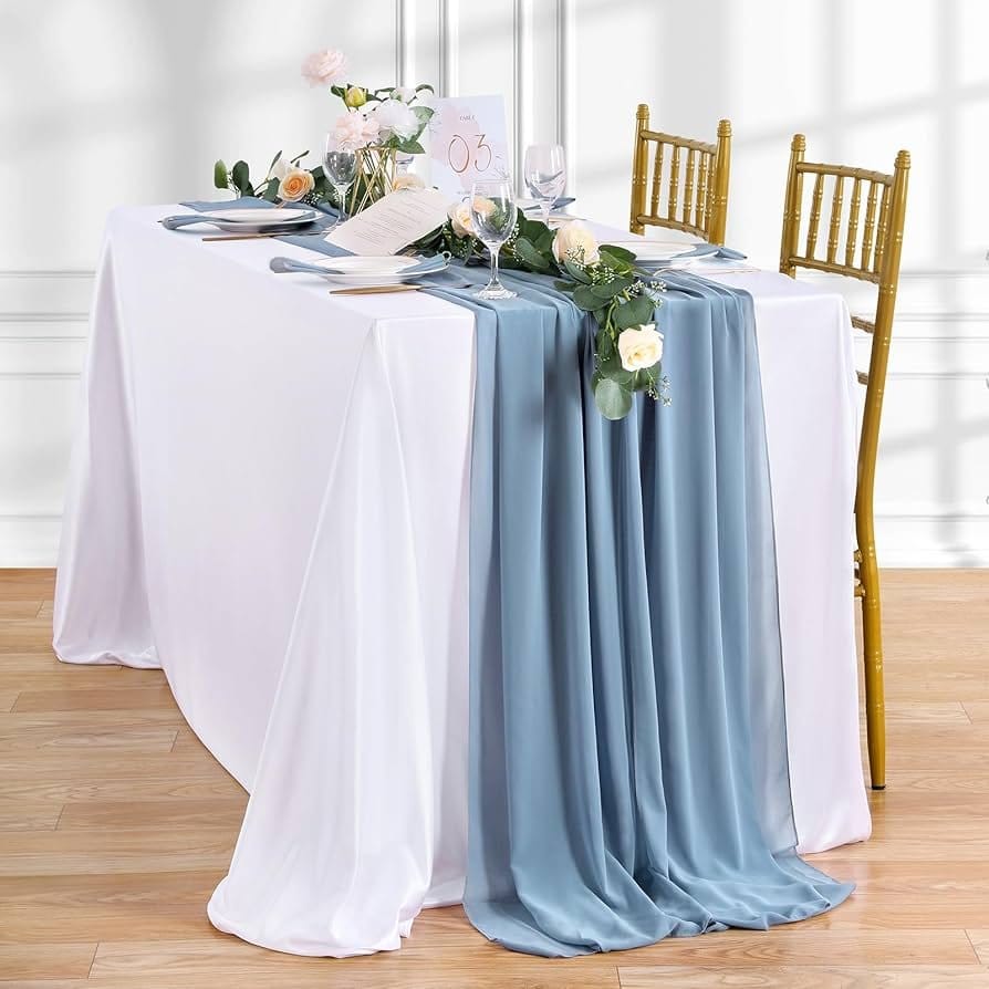 Rayon chiffon table overlay draped over a white table for wedding or event decoration