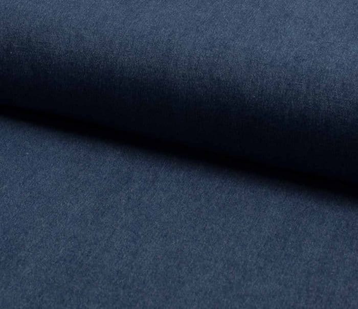 Dark blue enzyme washed denim fabric with a smooth soft surface and subtle faded appearance.