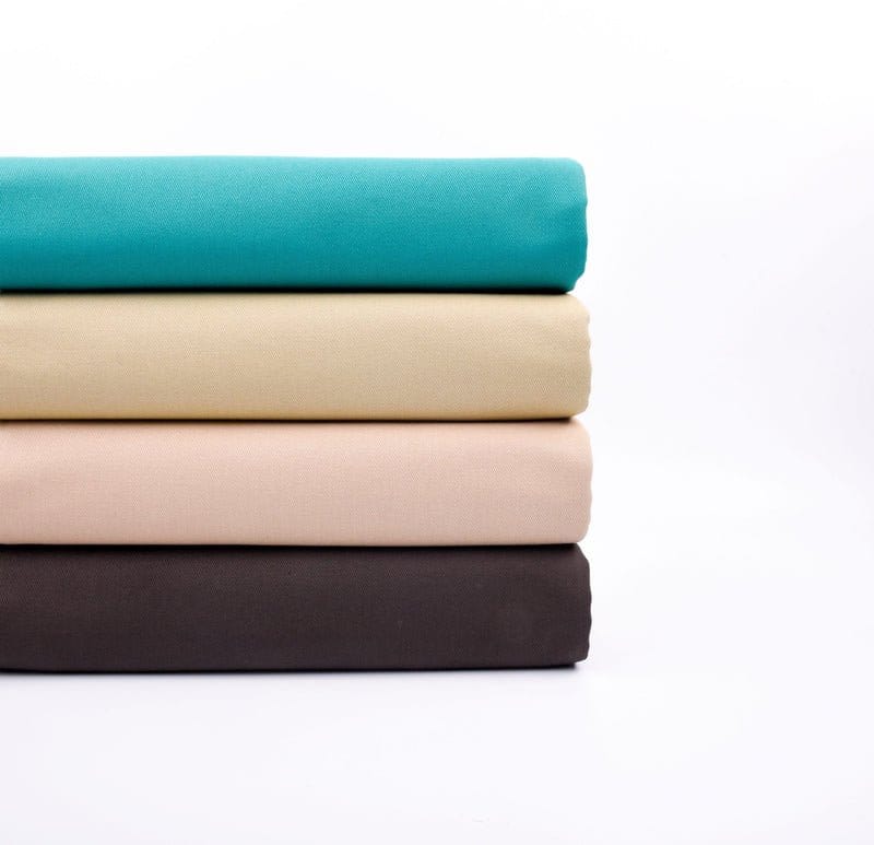 Stack of bull denim fabrics showing proper care and maintenance