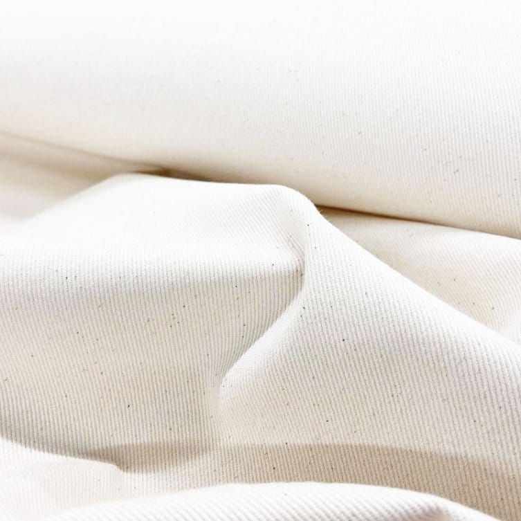 Close up of bull denim cotton fabric showing natural fiber texture