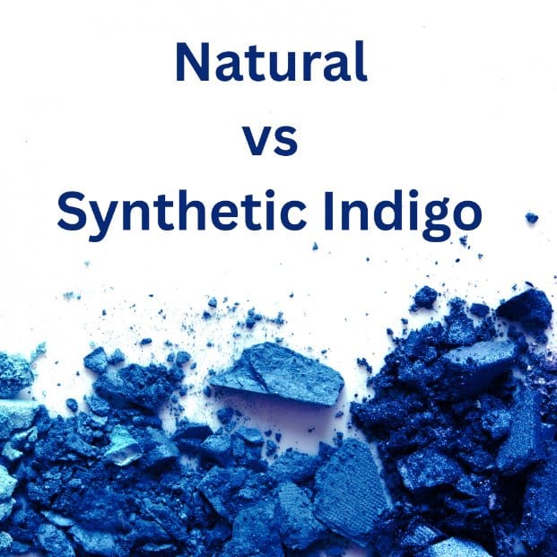 Blue indigo pigment pieces on a white background illustrating the comparison between natural and synthetic indigo for denim dyeing.