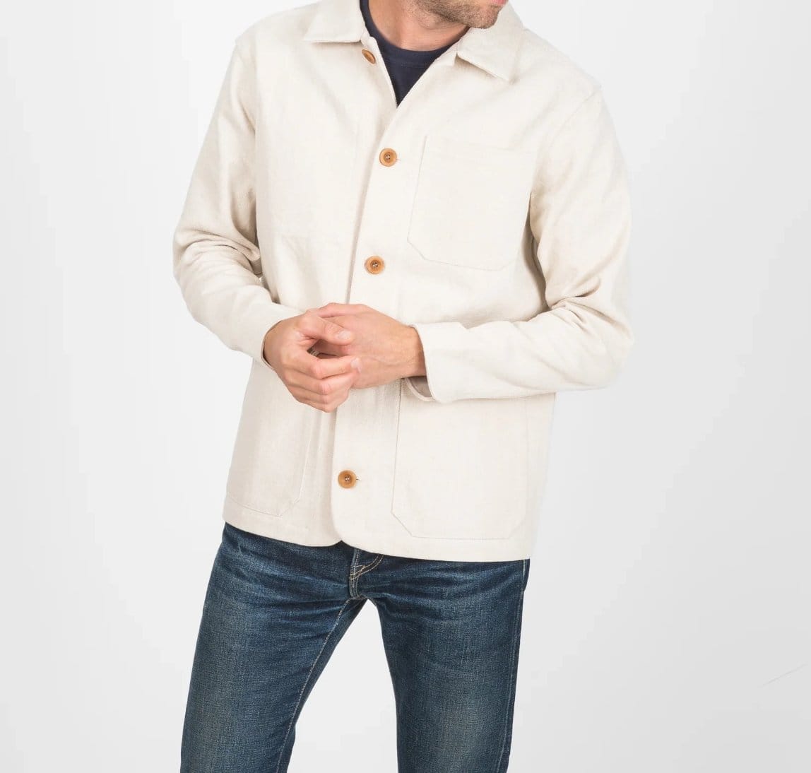 Men wearing cream bull denim jacket with button front and durable cotton twill fabric