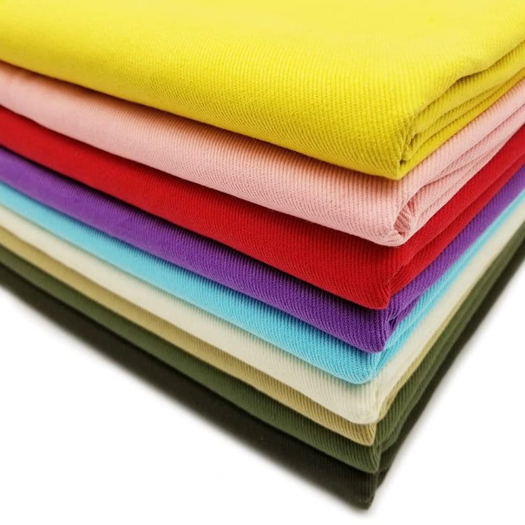 Colored denim fabrics stacked showing proper selection and care techniques