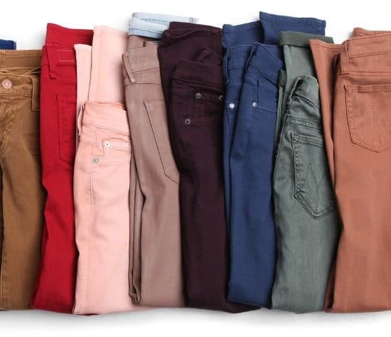 Colored denim fabric close up showing dyed cotton twill in vibrant shade