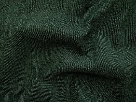 Green denim fabric texture with rich color and durable twill weave