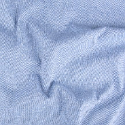Pastel denim fabric in soft colors showing smooth texture and lightweight feel