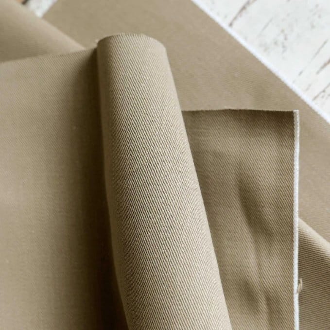 Tan denim fabric with clean twill weave and neutral earthy color