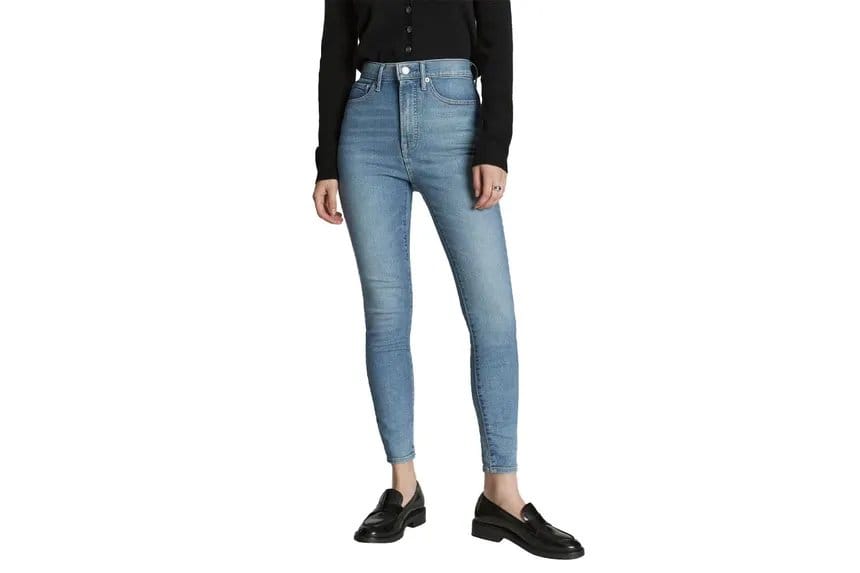 Woman wearing skinny stretch denim jeans made with spandex blend fabric.
