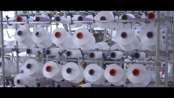 Industrial textile facility producing synthetic fibres used in spandex manufacturing.
