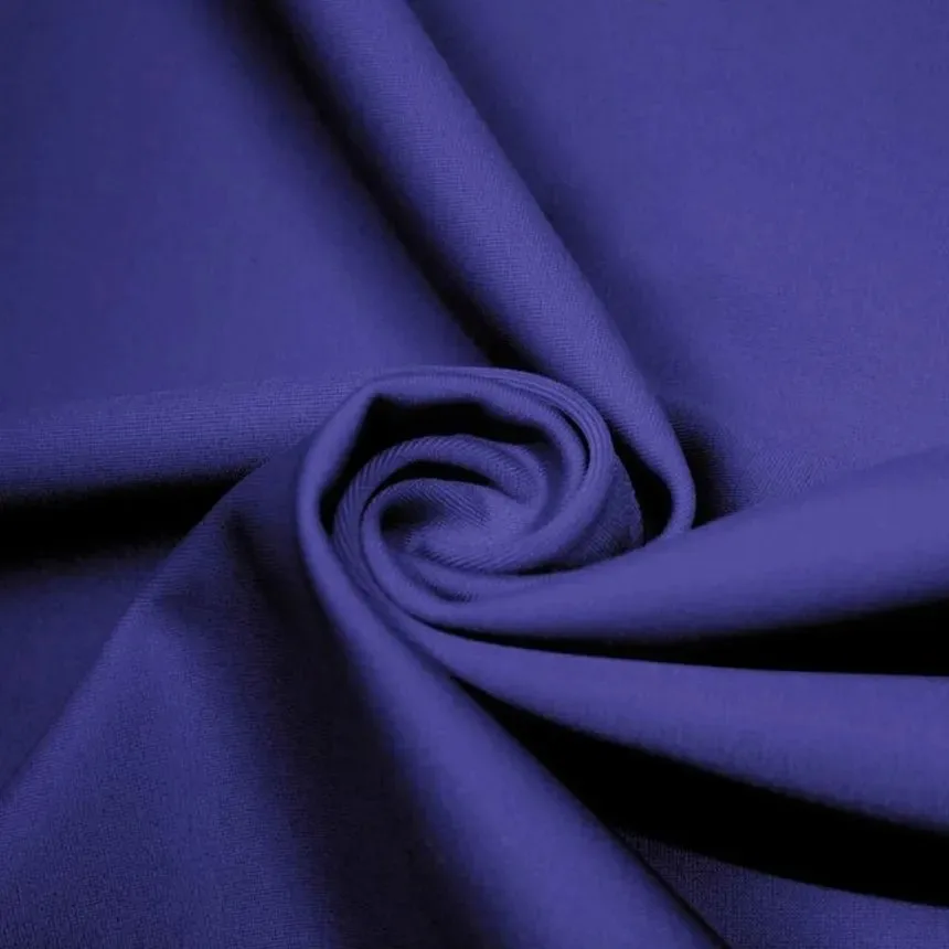 Blue microfiber nylon fabric with a smooth, soft texture and lightweight drape commonly used in activewear, sportswear and performance clothing.
