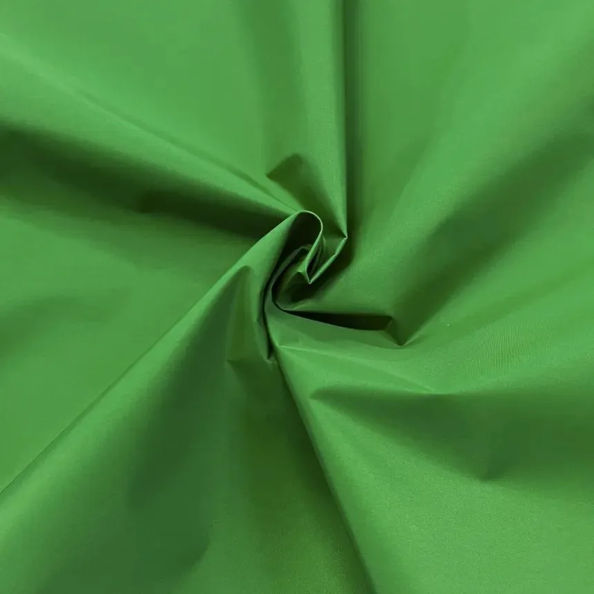 Bright green nylon taffeta fabric with a smooth, crisp finish often used in jackets, linings and outdoor apparel.