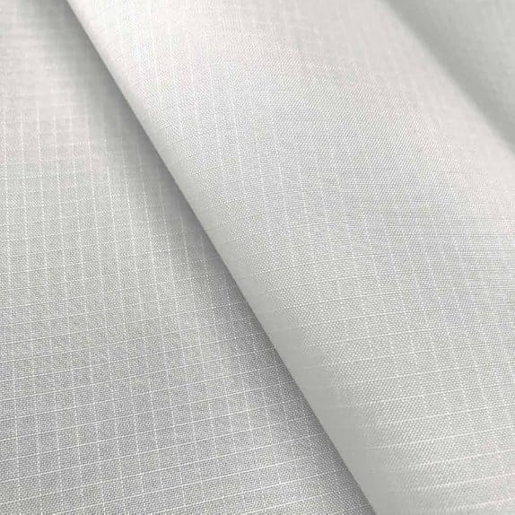 White ripstop nylon fabric featuring a reinforced grid pattern designed to prevent tears and improve durability.
